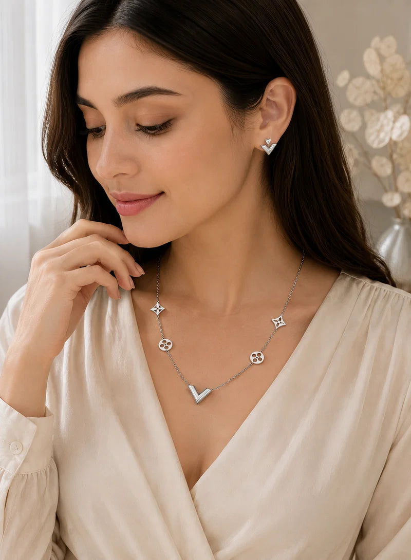 Model wearing Elegant V Jewelry Set Silver necklace and earrings